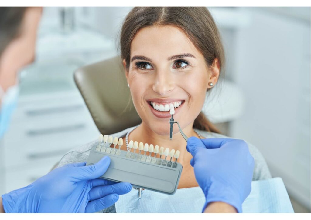 Patient undergoing professional teeth whitening treatment with LED whitening light at a dental office