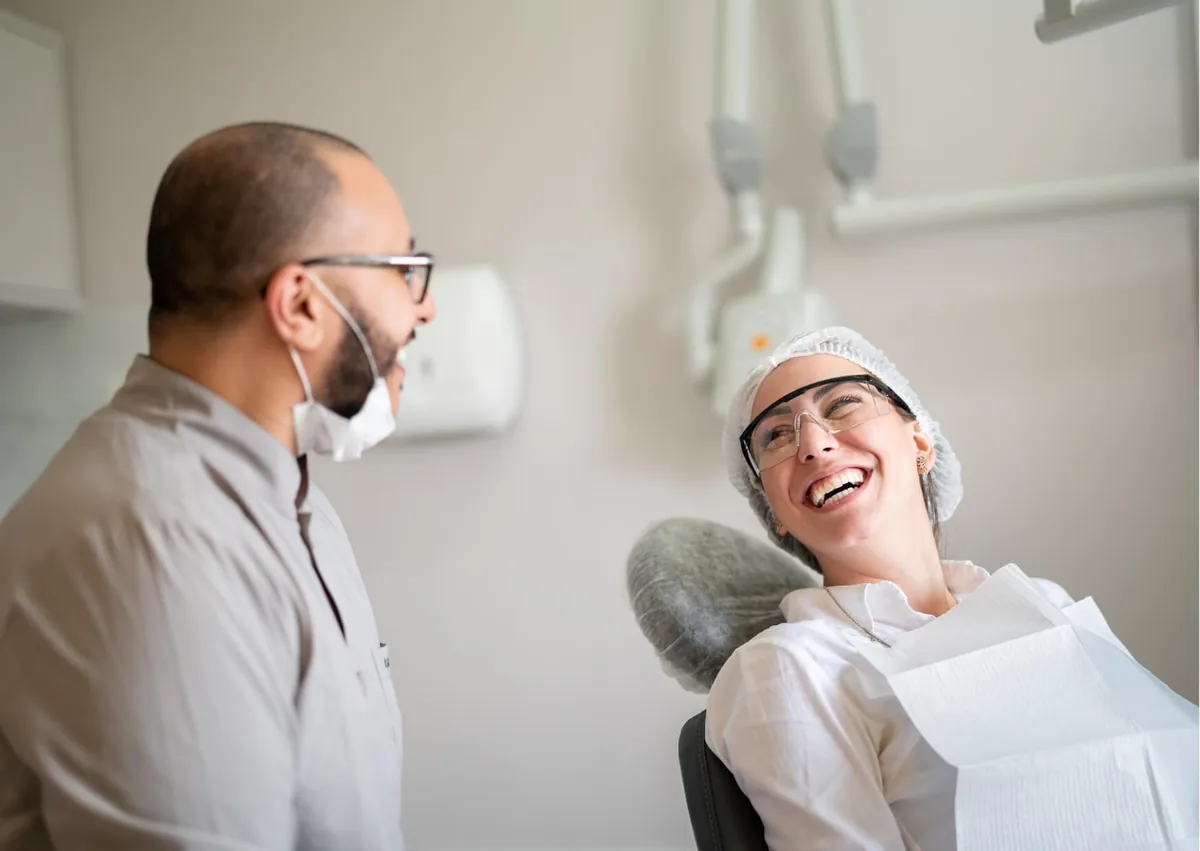 Patient speaking with a dentist before treatment with IV dental sedation for a more comfortable dental experience.